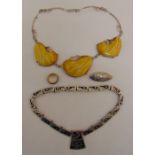 A quantity of costume jewellery to include two necklaces, a brooch and a ring