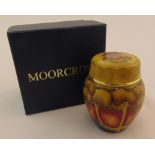 Moorcroft enamel miniature vase and pull off cover decorated with a sunset forest, marks to the