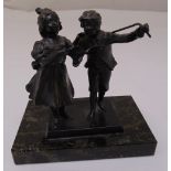 A cast bronze figurine of a boy and girl mounted on a rectangular marble plinth, 13cm (h)