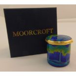 Moorcroft enamel moonlight blue circular box with hinged cover, marks to the base, in original