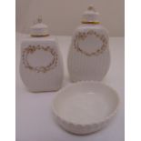 Two KPM Berlin porcelain dressing table bottles with covers and an oval dish, tallest 14.5cm (h)