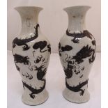 A pair of Oriental crackle glazed baluster vases, decorated with dragons chasing a flaming pearl,