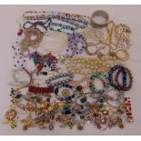 A quantity of costume jewellery to include necklaces, earrings, pendants and bracelets