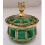 A Bohemian green glass dish and cover with gilded overlaid decoration, 16cm (d), A/F