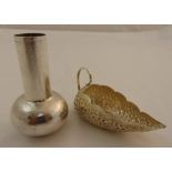 A white metal hand hammered vase and a white metal oriental dish heavily chased with leaves and