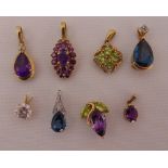 Eight 9ct gold pendants set with various coloured stones, approx total weight 20.2g