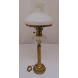 A Victorian brass oil lamp with frosted shade converted to an electric table lamp, 68.5cm (h)