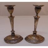 A pair of silver filled table candlesticks, Sheffield 1910, A/F
