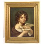 A framed oil on canvas of a girl holding a dove, 44 x 35cm