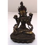 A Chinese gilded bronze Buddha on naturalistic base, 21 x 14cm