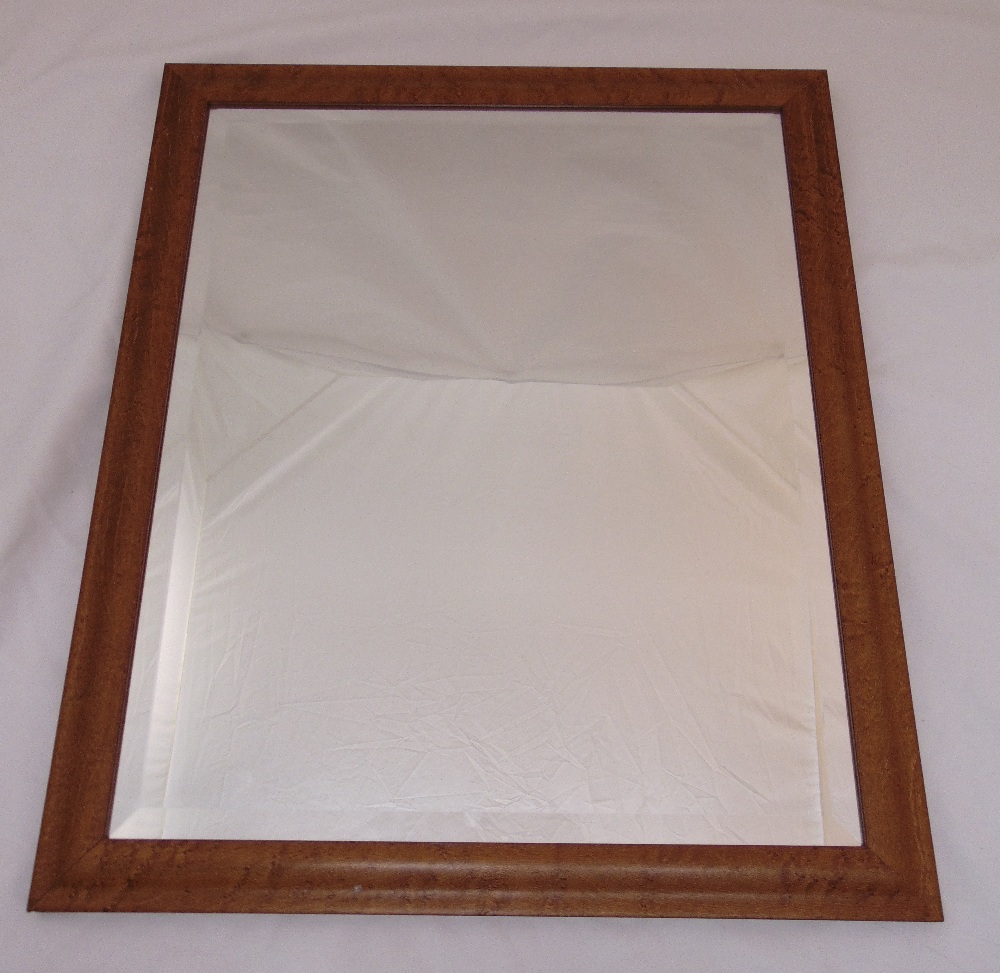 A rectangular bevelled wall mirror in a walnut veneered frame, 68 x 58 cm