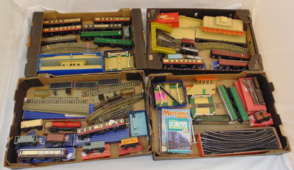 A quantity of playworn model railway to include coaches, trucks, track and accessories, some in