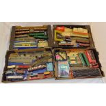 A quantity of playworn model railway to include coaches, trucks, track and accessories, some in