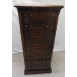 An oak early 20th century filing cabinet with four drawers and brass handles, 139 x 62 x 69cm