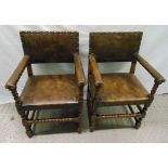 A pair of 19th century oak and leather armchairs with turned legs and stretchers