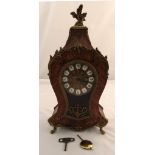 A French style marquetry mantle clock, gilt mounts and dial with Roman numerals on white enamel to