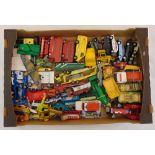 A quantity of diecast cars, trucks and buses to include Corgi, Matchbox and Dinky, all playworn