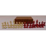 A late 19th century bone chess set in a wooden case