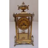 A French 19th century four glass and gilded metal chiming mantle clock, two train movement with