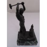 A cast metal figurine of a blacksmith at work on rectangular marble base, 34cm (h)