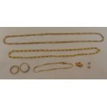 A quantity of 9ct gold jewellery to include two chains, a bracelet, two rings, a charm and a