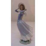 Lladro figurine of Windswept girl holding her hat, marks to the base, 35cm (h)