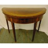 A Regency mahogany and satinwood inlaid demilune card table on four tapering rectangular legs, 74