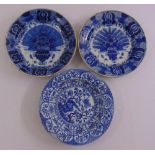 Three oriental blue and white chargers decorated with flora and fauna