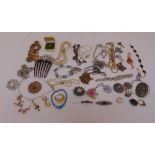A quantity of costume jewellery to include necklaces, brooches, rings, earrings and pendants