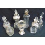 Six glass decanters of various shape and form five with hallmarked silver collars and a glass