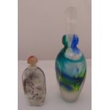 A coloured glass perfume bottle with drop stopper and a Chinese reverse painted glass snuff bottle