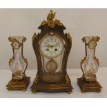 A French 19th century clock set, the clock with enamel dial Arabic numerals, the pendulum with
