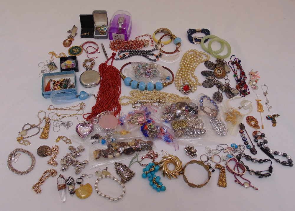 A quantity of costume jewellery to include earrings, necklaces, bracelets, brooches and coral