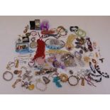 A quantity of costume jewellery to include earrings, necklaces, bracelets, brooches and coral