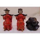 A pair of novelty 1920s oriental ceramic figural bookends and a carved wooden figurine of a crying