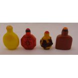 Four Chinese snuff bottles of various form and colour with detachable domed covers, tallest 7cm (h)