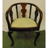 A mahogany occasional chair, pierced sides on four scroll legs, 77 x 51 x 52cm