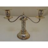 A Victorian silver two branch candelabrum, of tubular form on raised circular base, leaf and