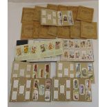 A quantity of cigarette cards in twenty albums to include flowers and racing cars