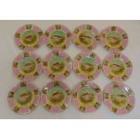 A set of twelve Victoria Czechoslovakia fish plates, decorated with images of various fish to the