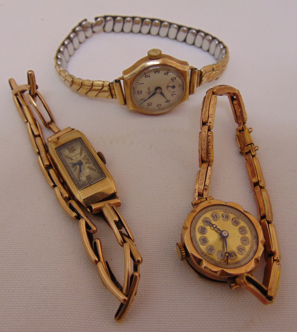 Three 9ct gold ladies wristwatches, one on expanding gold plated bracelet