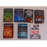 Seven first edition signed hardback books with original dust jackets to include titles by Lee Child,
