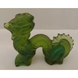 Lalique carved frosted green figurine in the form of a stylised dragon, 7 x 9.5cm