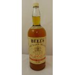 A rare bottle of 8 pints of Bells Whisky signed by Matt Busby and the 1960s Manchester United Team