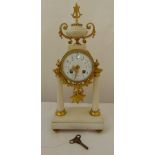 A French 19th century ormolu and white marble striking mantle clock with white enamel dial, Arabic