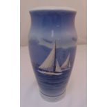 A Royal Copenhagen baluster form vase depicting a hand painted scene of sailing boats, marks to