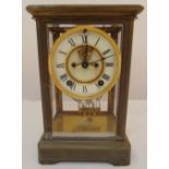 A brass and four glass mercury balance pendulum mantle clock, rectangular, white enamel dial,