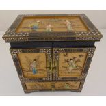 A rectangular ebonised and inlaid Chinoserie style chest with double door cupboard and single