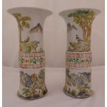 A pair of Chinese Republic period Kangxi style vases of cylindrical form decorated with landscapes