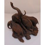 A carved wooden figural group sculpture of elephants, 50 x 40 x 42cm, A/F